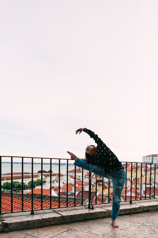 dancer dancing against cityscape