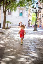 Smiling child standing on street