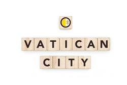 Wooden blocks bearing the name and flag of Vatican City. Vatican and European Culture, national identity, travel, and geography in a copy space design.