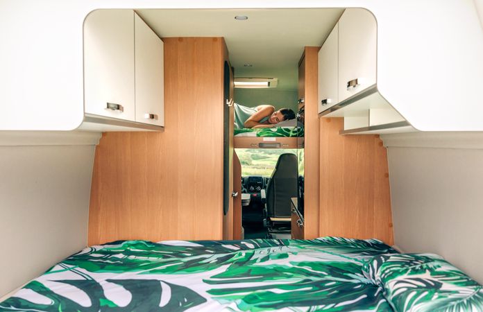 Female napping in motorhome bunk bed