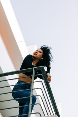 Stylish Black female on balcony