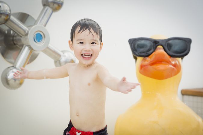 Smiling boy playing at the water park