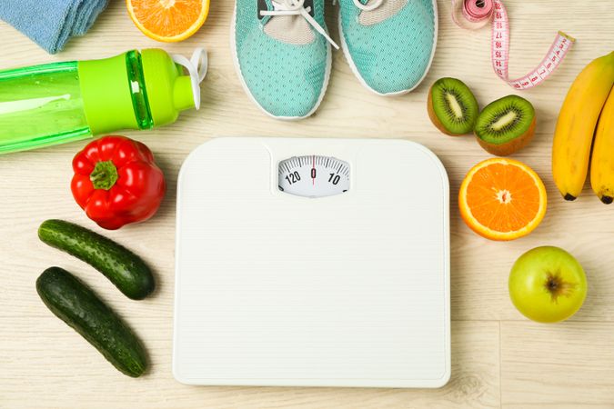 Healthy lifestyle accessories on neutral background, top view