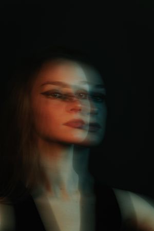 Blurry portrait of young woman with make-up