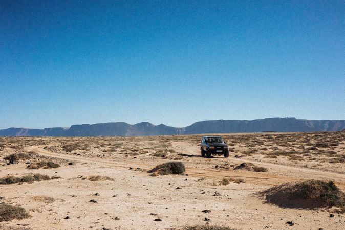 Truck off-roading in arid terrain