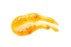 Apricot jam isolated on plain background, close up