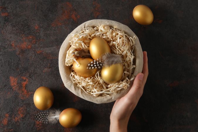 Concept of Richness, golden eggs, top view