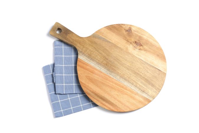 Cutting board with kitchen towel isolated on plain background, top view