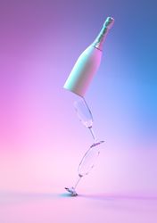 Champagne bottle with glasses ultraviolet and holographic neon lights