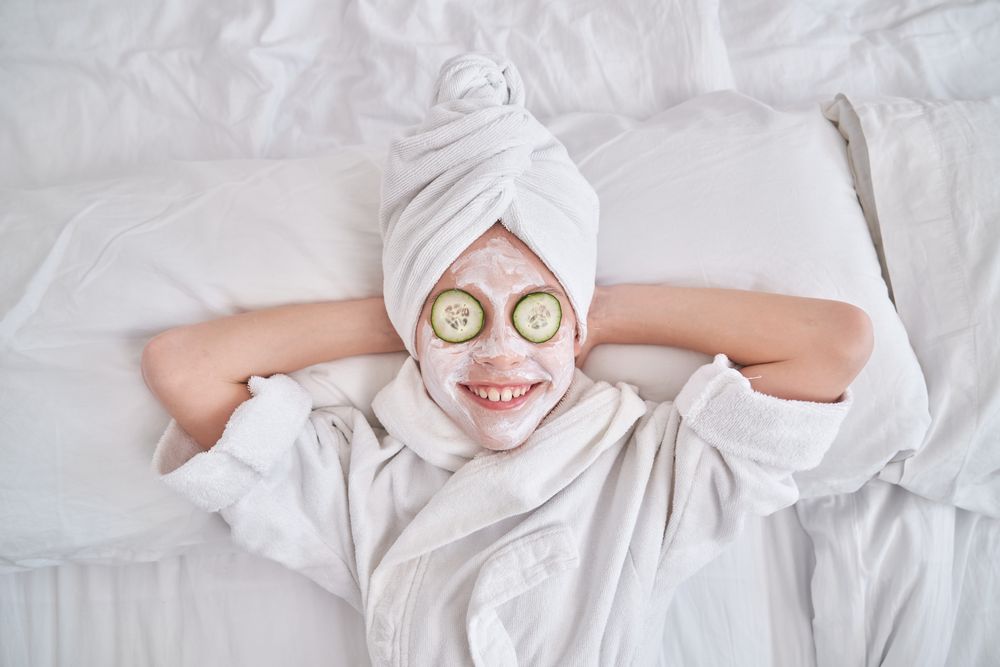 Cheerful kid on spa treatments