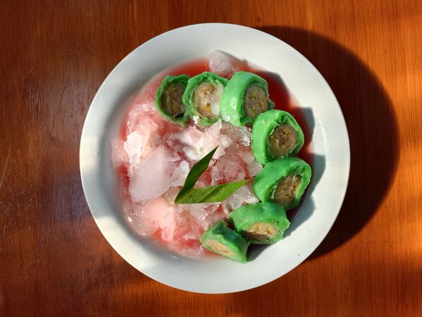 A bowl of traditional food with banana as the main ingredient