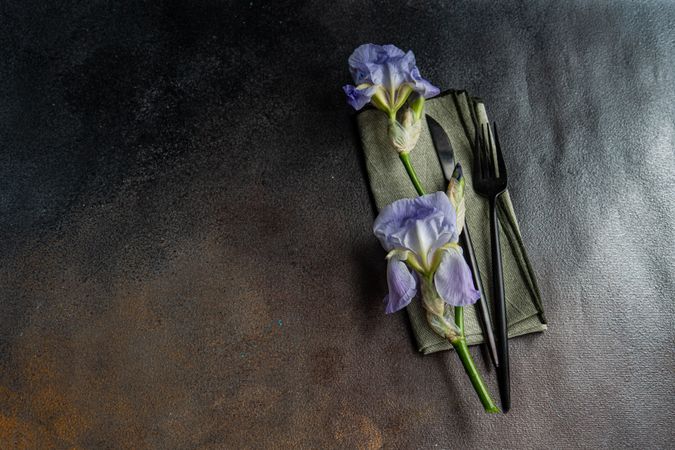 Table setting with pale blue iris flowers