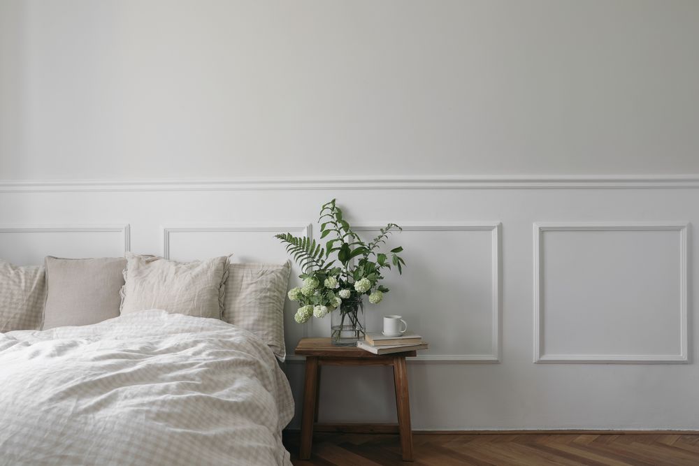 Bedside table next to comfortable bed