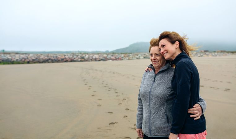 Two women looking at sea