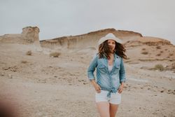 Female tourist walking on sandy quarry