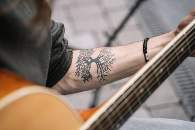 Male musician performing in the street