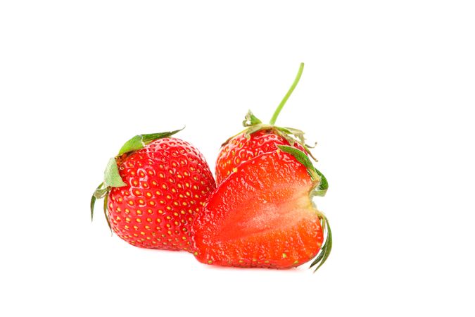 Strawberries isolated on light background. Summer sweet fruits and berries