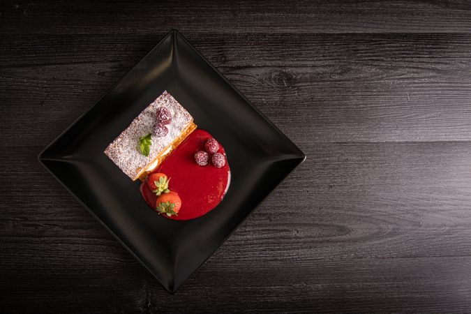 Diphlomate cream and red fruit strudel in elegant plate