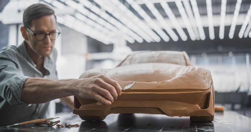 Portrait of an Automotive Artist Making Final Strokes on His Latest Concept Car Creation.