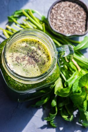 Green smoothie in mason jar with chia seeds
