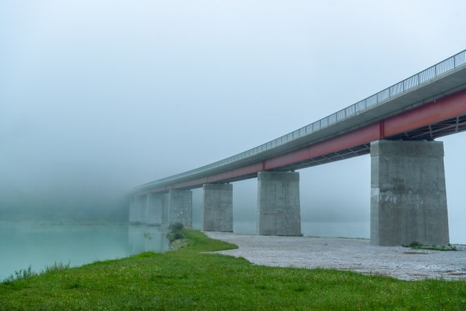 Sylvenstein Lake Bridge on a foggy morning, side view from under the bridge