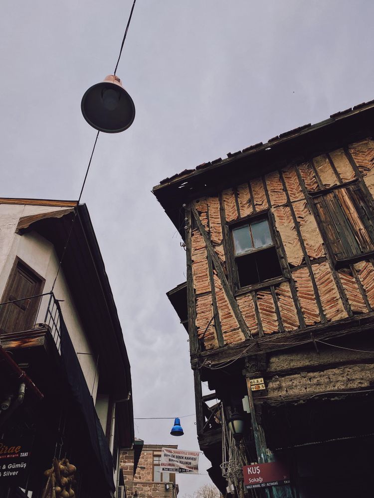 Looking up at old building on overcast day