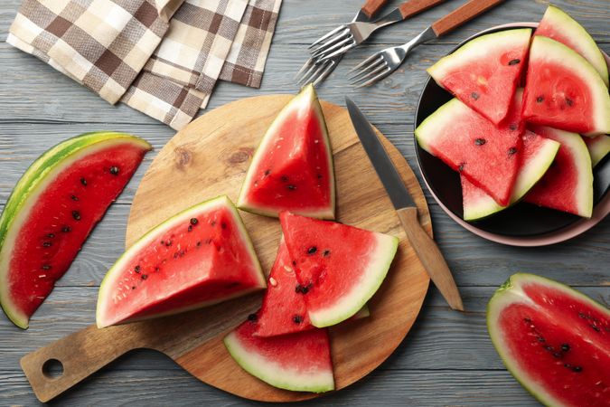 Composition with watermelon slices on gray wooden table. Summer fruit