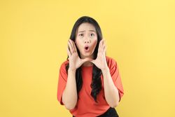 Young Asian Woman Shout Story or making Announcement with Surprised Face