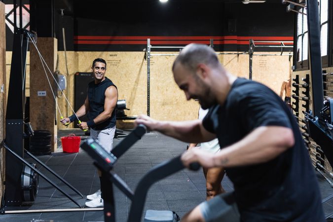 Hispanic sportspeople training in gym