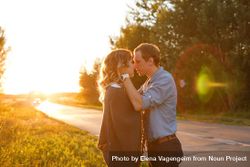Girlfriend and boyfriend about to kiss at sunset 56XAxb