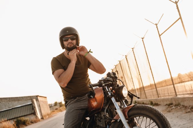 Strong man driving motorcycle