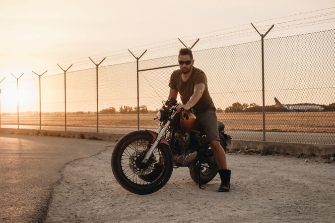 Strong man driving motorcycle