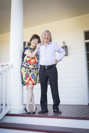 Mature Chinese Couple Enjoying Their House