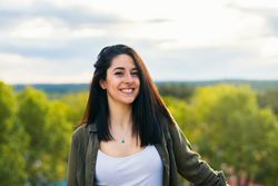 Smiling young woman portrait on a terrace