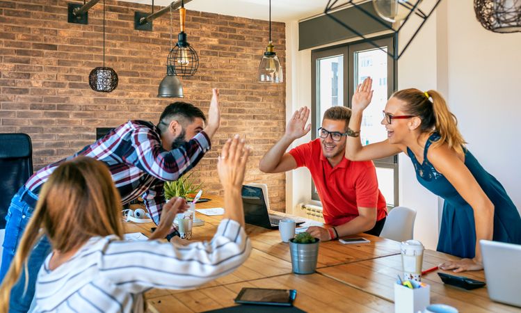 Businesspeople celebrating a success in office