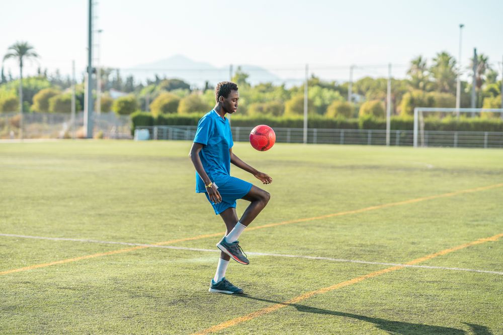Black juggling football ball