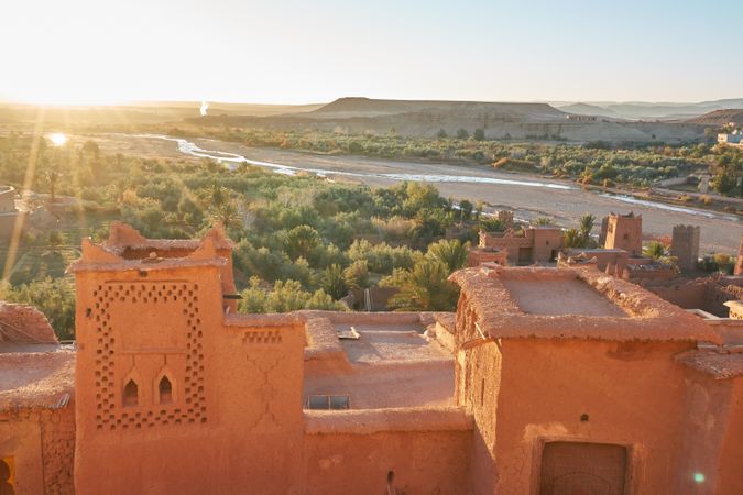 Ancient city near river in desert and wonderful sky