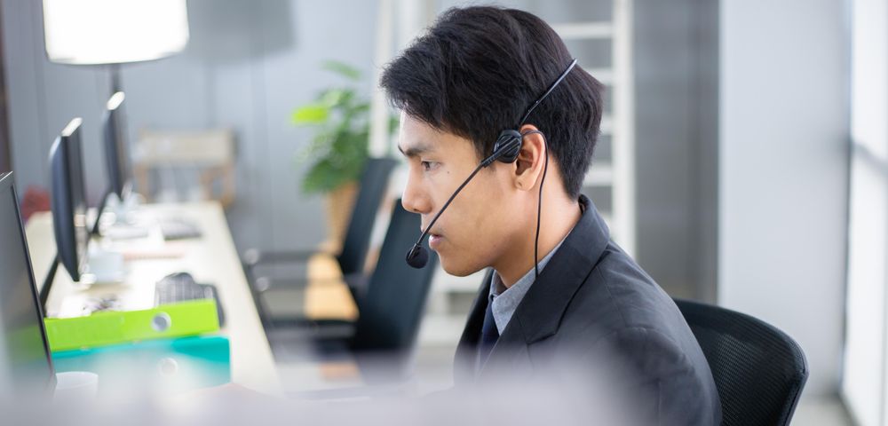 Banner of man at work wearing headset