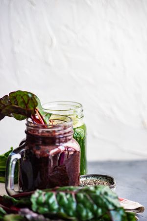 Beet and green smoothies with copy space