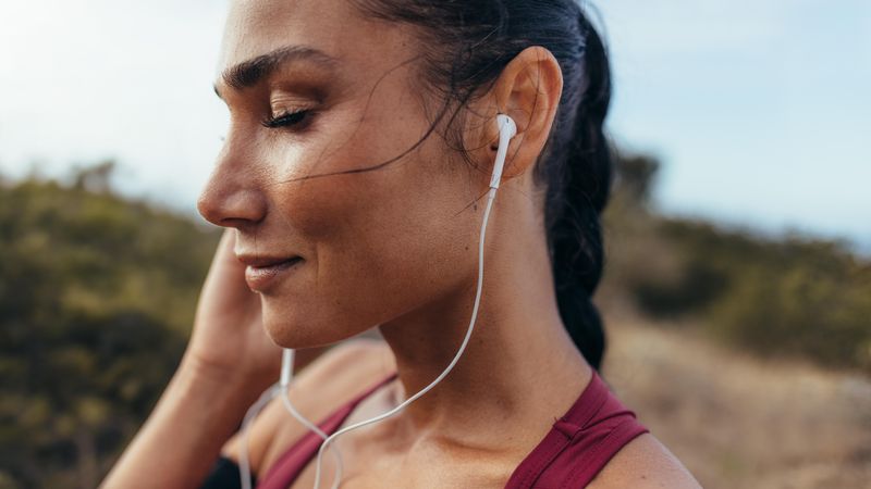 Close up of woman listening to music with eyes closed