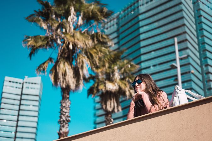 Teen girl watching the street while listening to music.