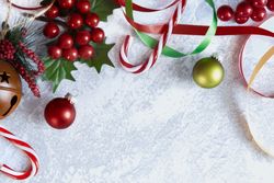 Christmas Background with Christmas decorations on a grey backdrop.