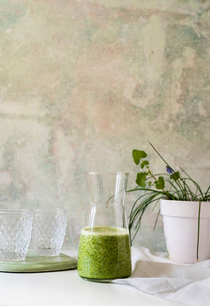 Organic Green smoothie detox drink in a glass bottle