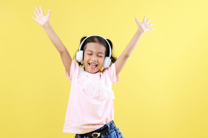 Asian Little Girl Kids using Headphone