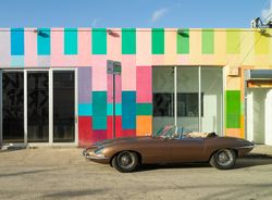 Colorful painted building and convertible in Miami