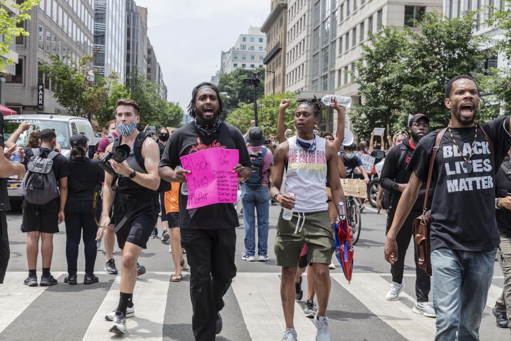 Group of people marching on the street for a BLM protest, Washington, D.C.