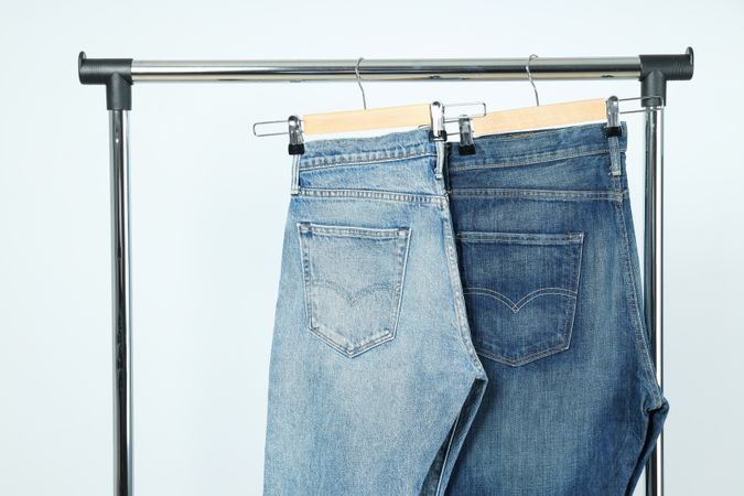 Jeans hang on hangers