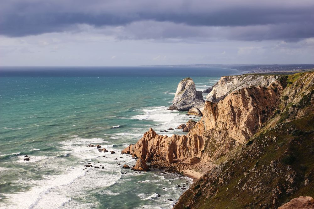 Beautiful steep coast, rocks at Praia da Ursa beach, Portugal.