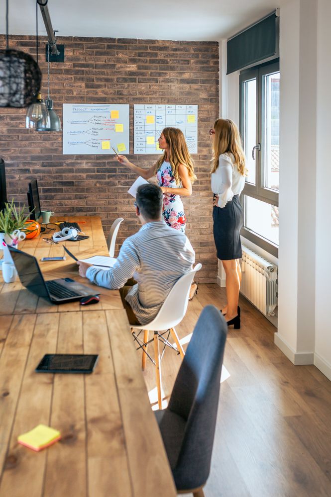 Female manager in a work meeting with her workers