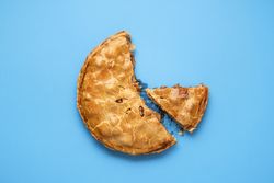 Sliced apple pie with a golden crust